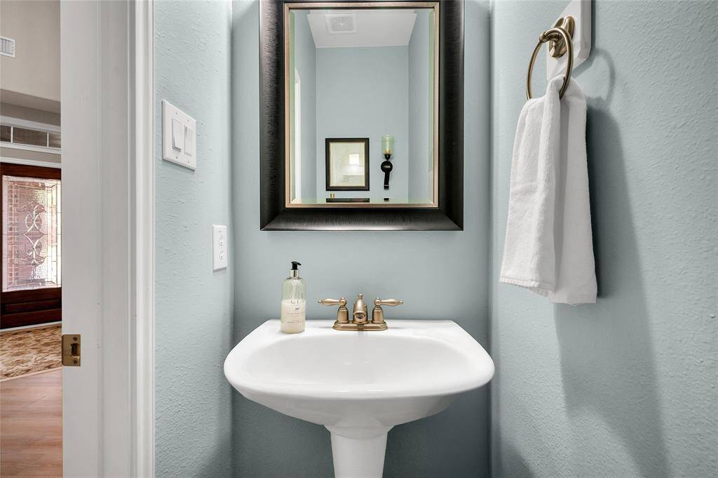 Half Bath right off family area and kitchen for easy access.