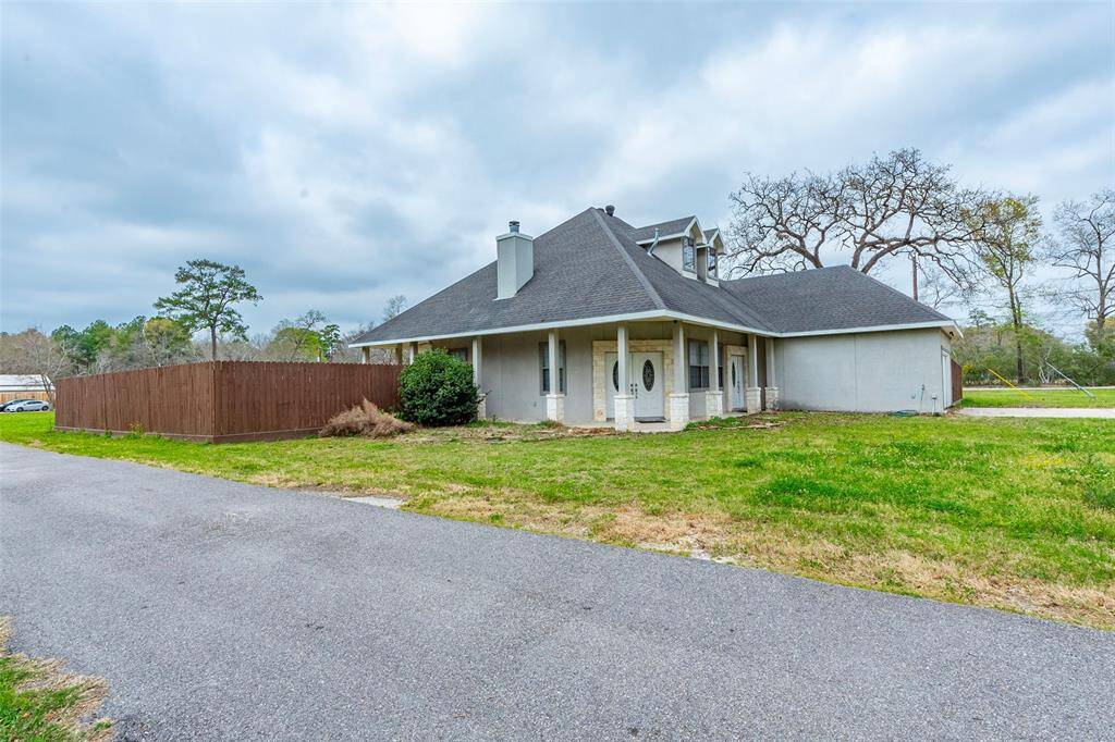 The front house has it's own driveway and garage.