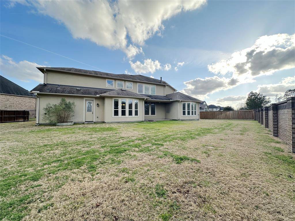 View a back of house and large backyard