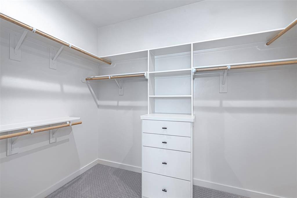 Primary closet with built-in shelves