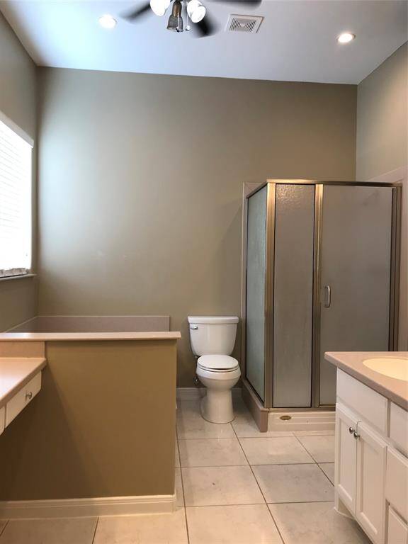 The main bathroom has separate vanities.