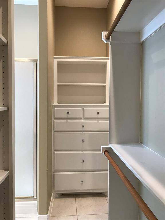 This is just 1 of the walk-in closets for the main bedroom with built-in drawer cabinets.