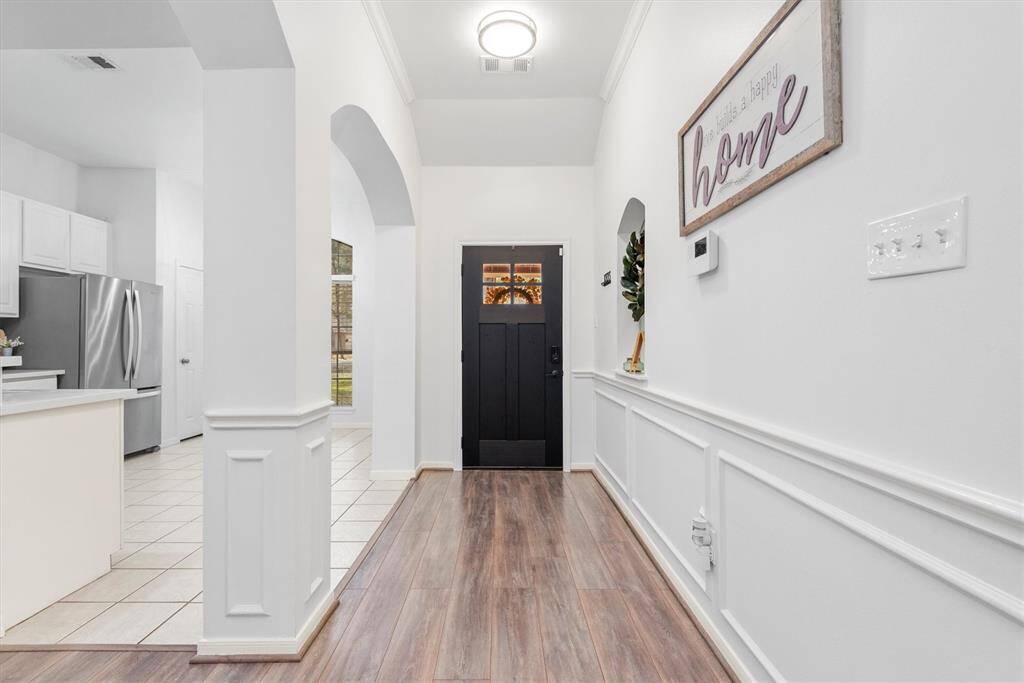 It gets even better on the inside. Decorated with modern clean lines and a neutral color palate this interior will wow those with the most impressive tastes. The crown molding, chair rail and wall accent add such a touch of charm.