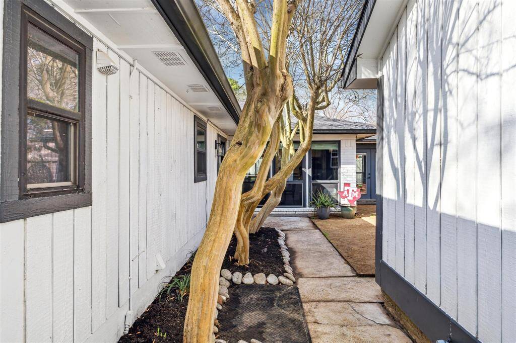 The walk leading to the large courtyard and private front door.