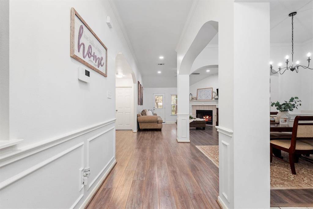 The luxury vinyl plank flooring flows seamlessly throughout the home, creating a cohesive and modern look. Designed for both style and durability, this low-maintenance flooring offers the beauty of hardwood with easy-care convenience—perfect for everyday living. The warm colors are perfect.