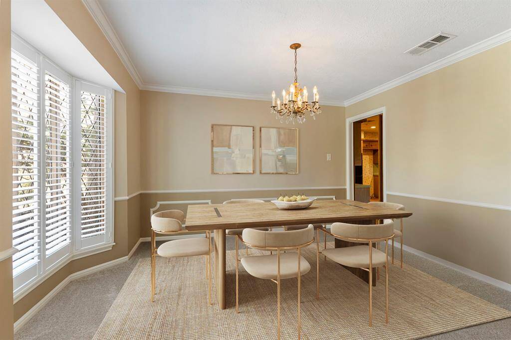 The formal entryway offers wood floors and crown molding. Fresh interior paint throughout!