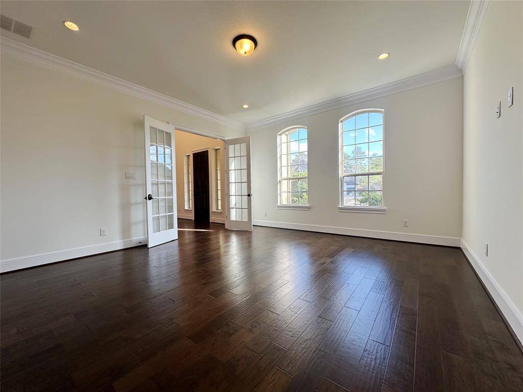 Virtually staged living room area with vaulted ceilings