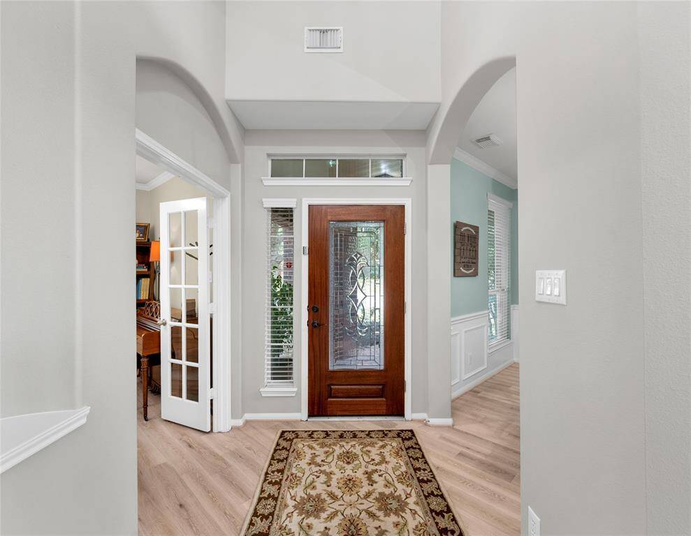 Elegant entry with dining and study placed on either side.