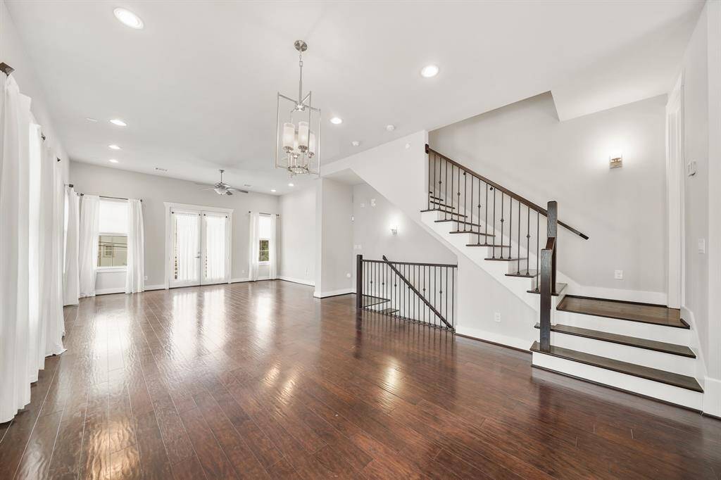 The open & flowing floor plan offers numerous furniture placement and decorating theme opportunities. The entire second level of the home was just re-painted and don't miss the wrought iron staircase with treads leading to the third level of the home.