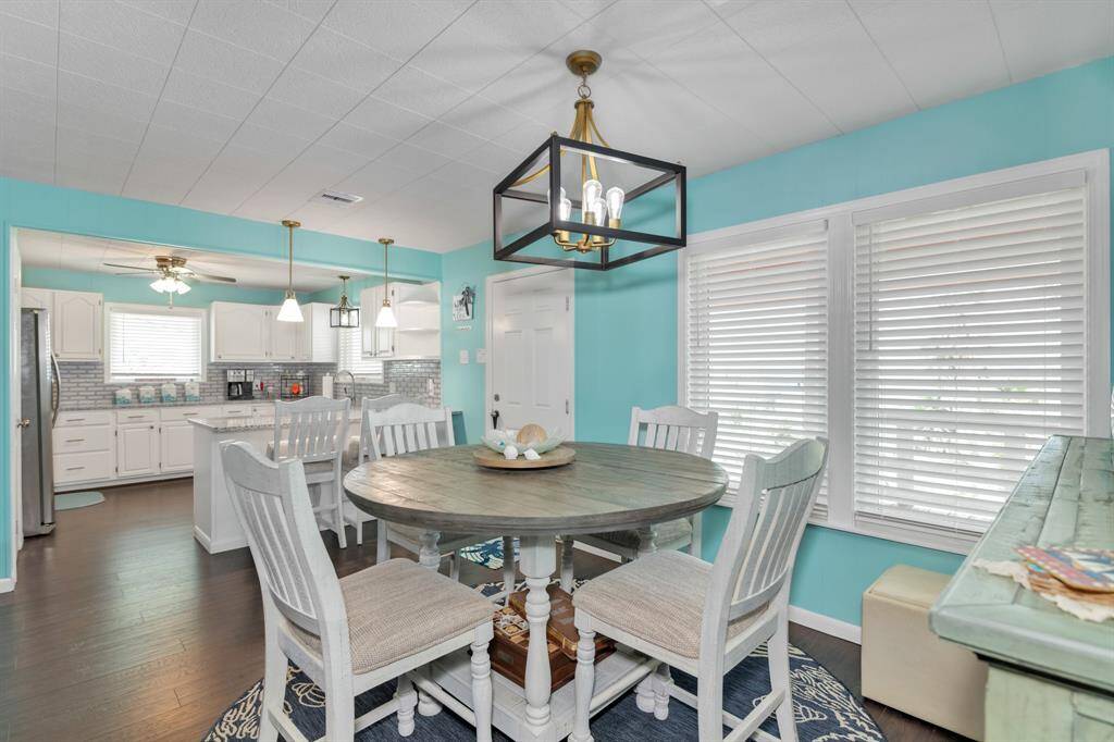 The dining room is open to the living room and kitchen