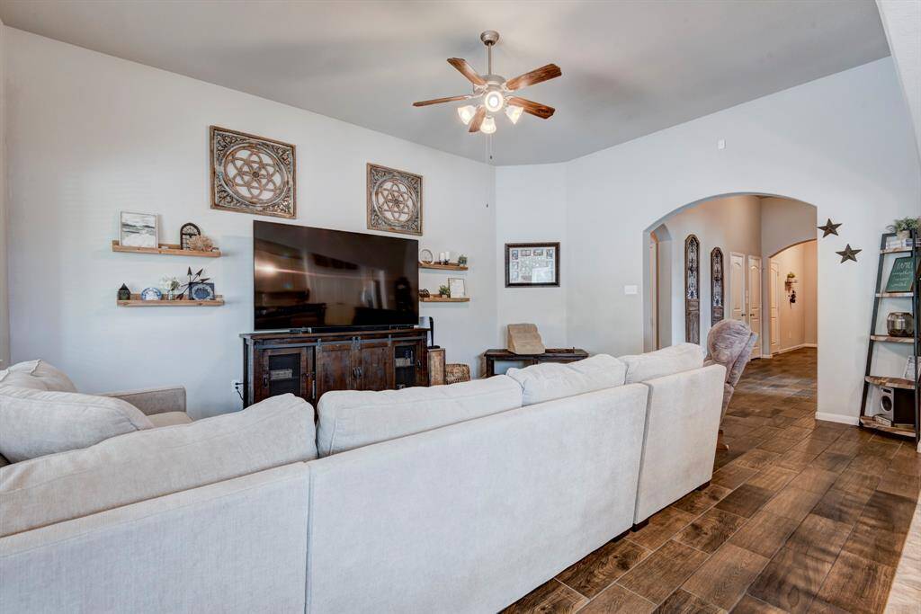 As you continue down the foyer it will open up to the family room and kitchen.