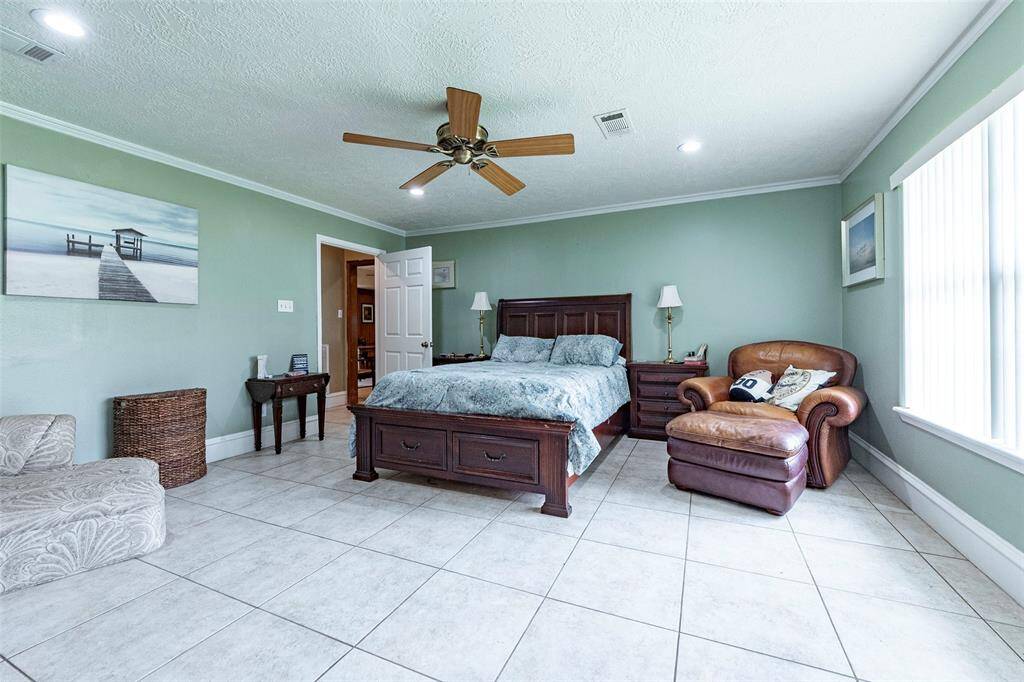 The main bedroom is large, affording a king size bed with as much furniture as you have.