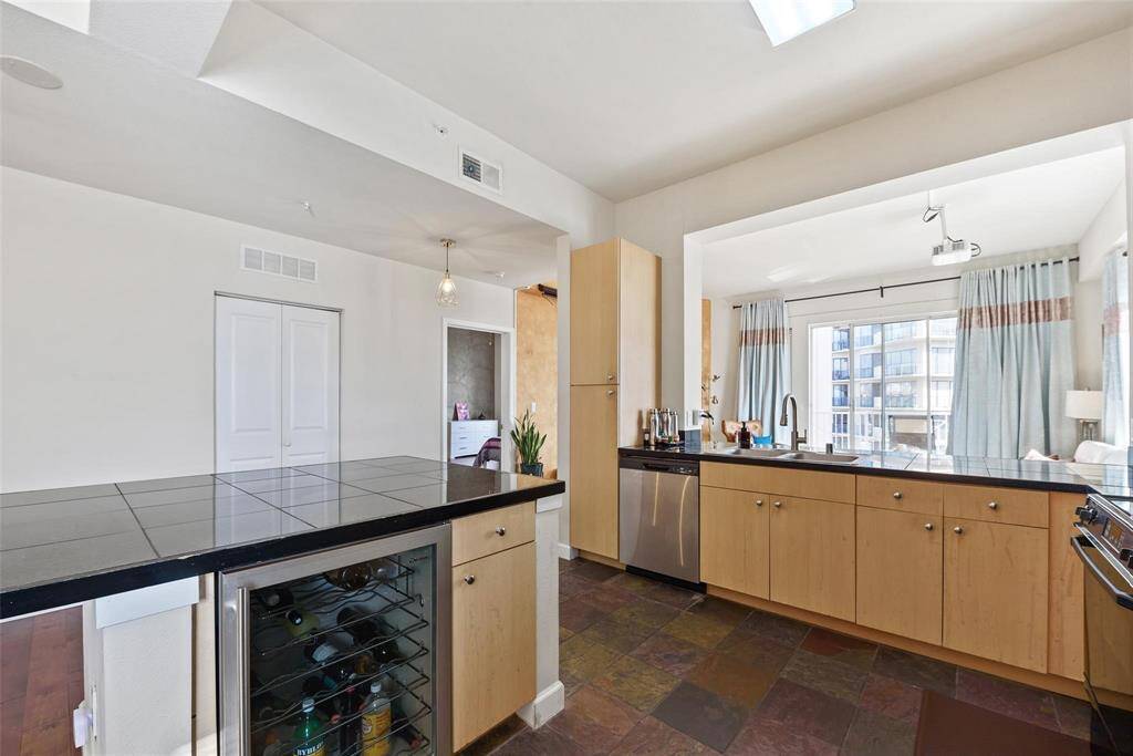 The beverage cooler is a bonus! The utility closet house the washer and dryer with additional storage space.