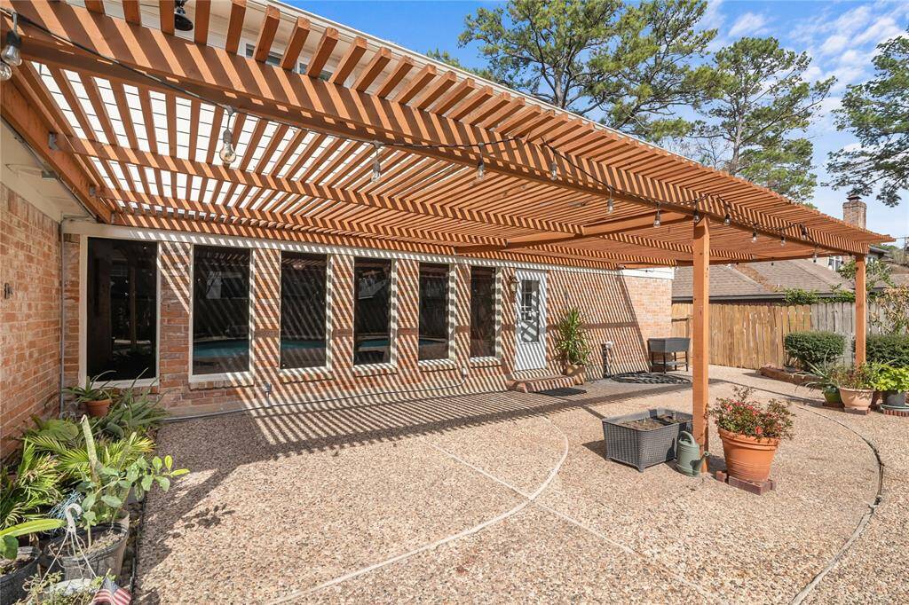 The family room overlooks the backyard. It's big windows are tinted to keep the room cooler.