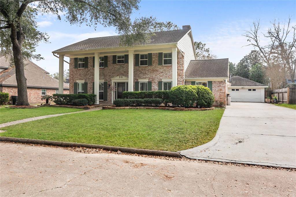 The property also includes a detached garage and plenty of parking on this long driveway.