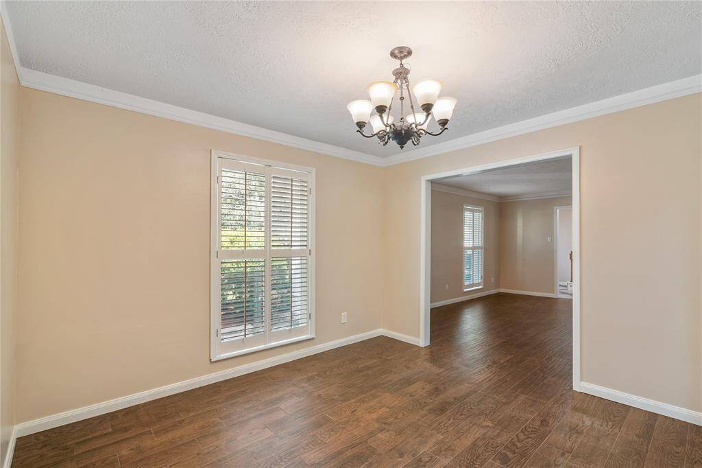 Enjoy a formal dining room with classic lighting and large windows. Dining room has easy access to the kitchen.