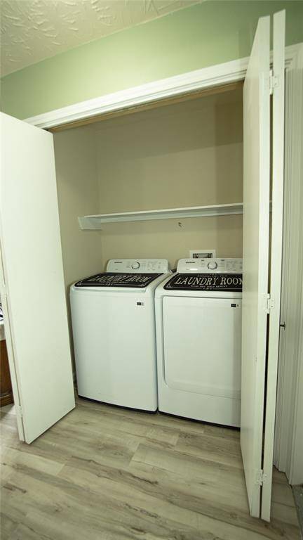 Utility room is located in-house and on the first floor adjacent to the living room, garage, and guest bathroom.