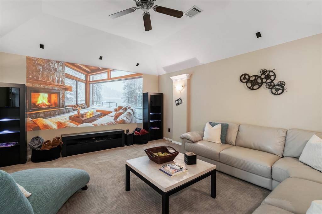 This cozy media room features special media room paint used for large projection screening for movie nights, and a modern ceiling fan and movie lighting that is adjustable to fit your desired ambiance. It's perfect for relaxing and entertaining.