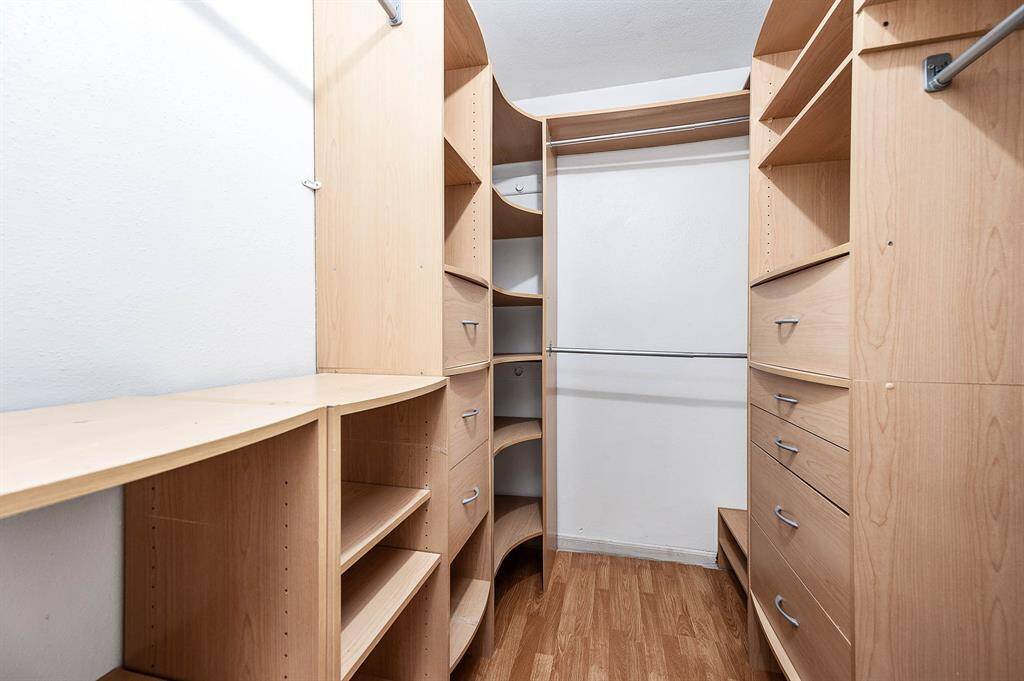 Primary Walk-In Closet with Built Ins.