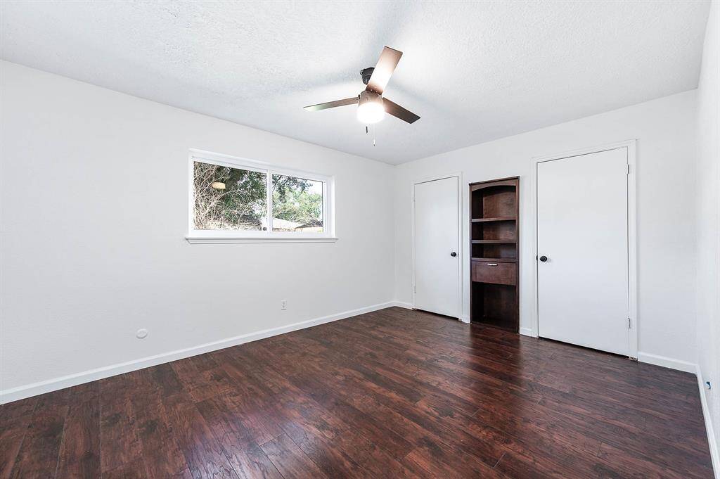 Bedroom #3 with double closets & views of Back Yard