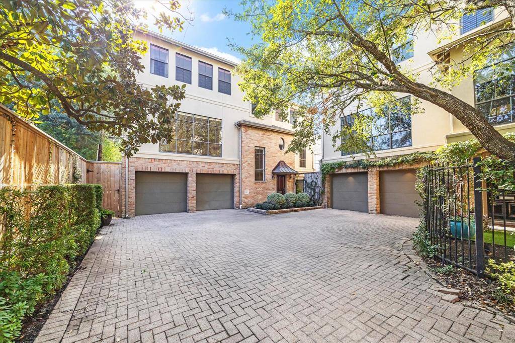 Expansive brick drive, new fencing and early stage espaliade vines await as you enter the property.