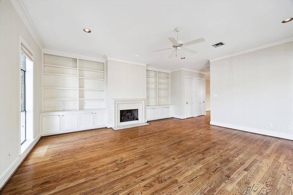 Another perspective of the living area with recessed lighting and floor outlets to eliminate unsightly lamp cords.