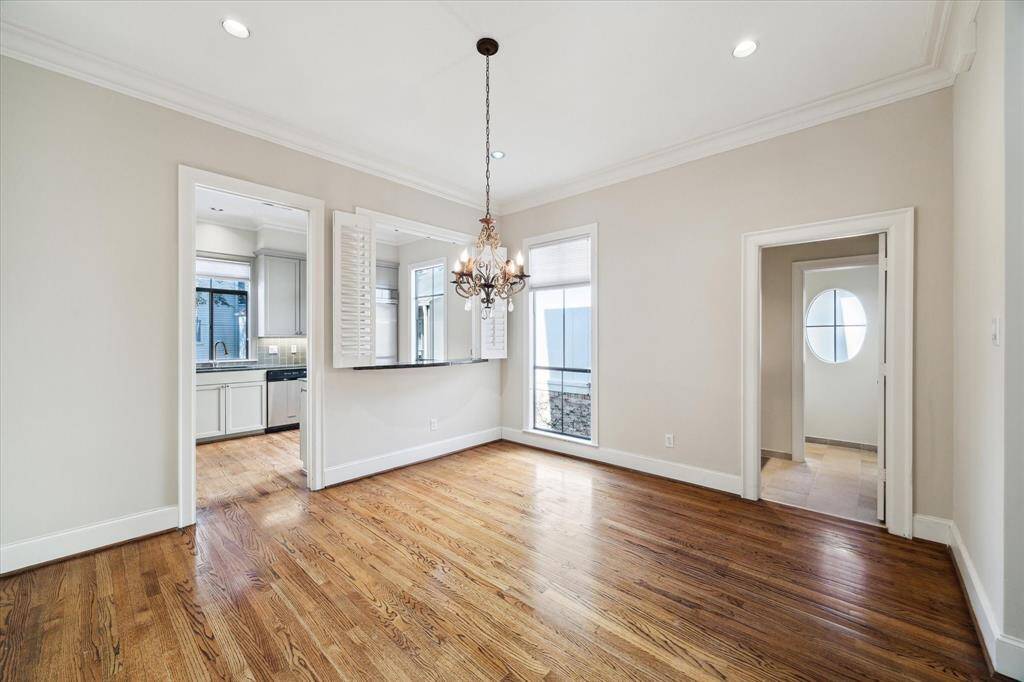 Dining room with views to the kitchen and the powder bath.
