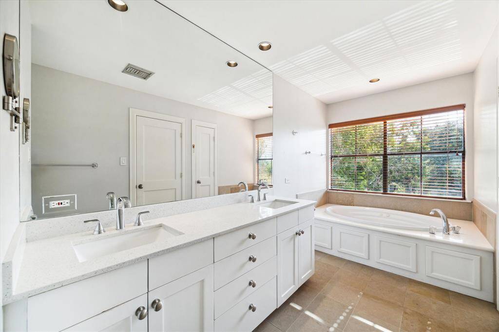 Third floor, primary bath with recent dual sinks, separate shower and jetted tub.