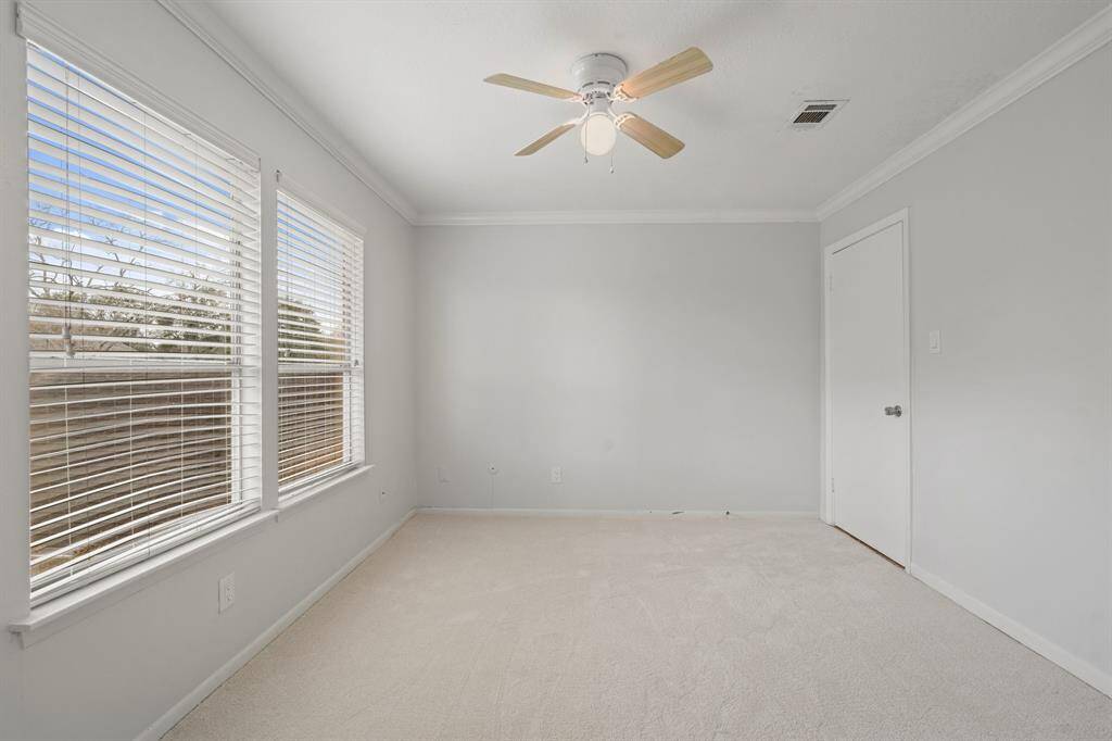 Primary Bedroom with Ensuite Bath features his/her separate walk-in closets.