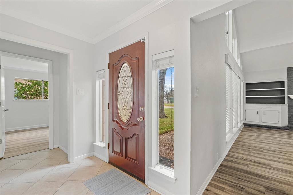 Front entry provides access to the Living Room and two bedrooms on the first level.