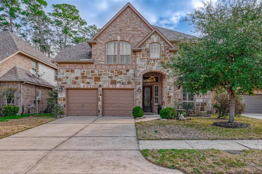 This beautiful two-story Westin home features stone/brick elevation a welcoming front entrance. It is surrounded by a well-maintained lawn and mature trees, offering both charm and curb appeal in a serene neighborhood setting.
