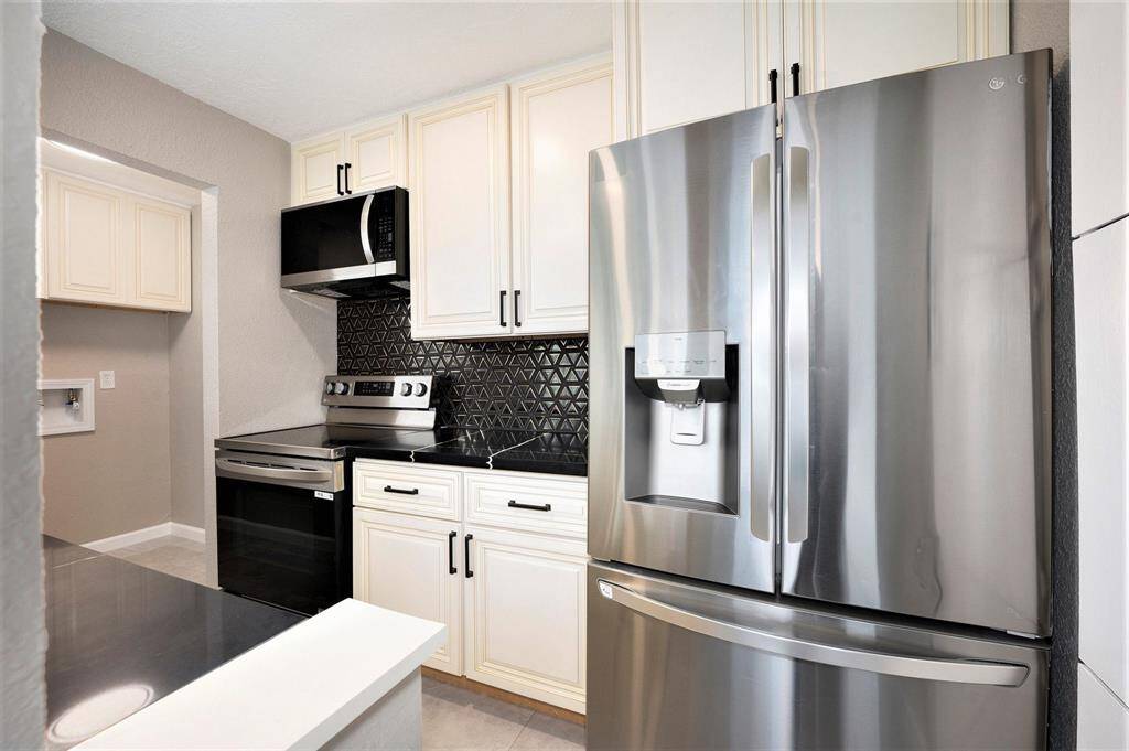 INDOOR UTILITY ROOM WITH CABINET STORAGE