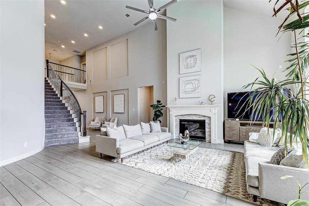 Spectacular view of this living area. Look at the elegant staircase with LED lights that gives charm and comfort.
