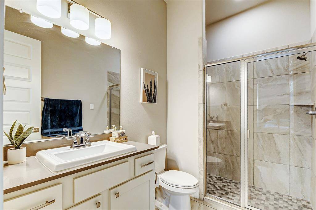 In suite bathroom for your secondary bedroom (1st floor) with glass door in shower