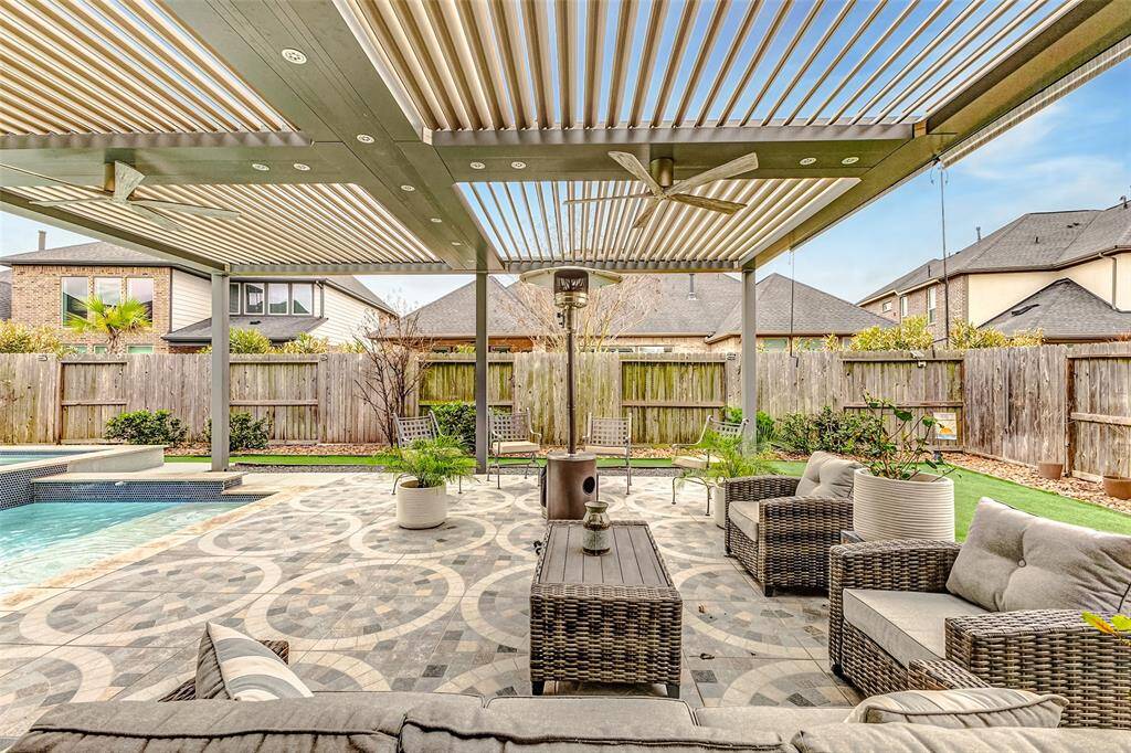 Unique motorized pergola with lights and ceiling fans