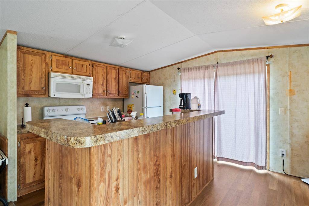 The kitchen brings a rustic and vintage look to the home!