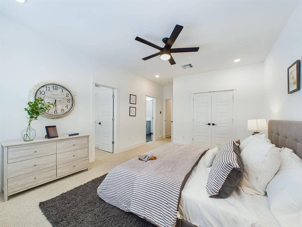 Very spacious primary bedroom located on the 2nd floor. The high ceilings, with recessed lighting, are prewired and blocked for ceiling fans (not included).