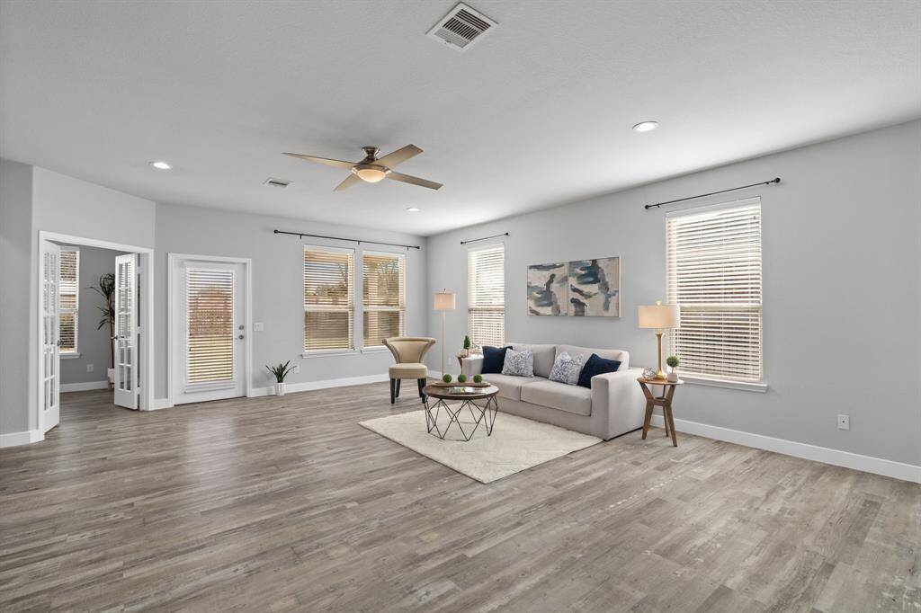 Open concept living area, combining the kitchen, dining and gathering room into one spacious and open space. Please note behind the pictures is TV HDMI cable box for easy installation of a wall TV.