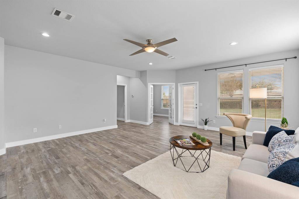 The generous wall space allows for placement of a sideboard and accommodating a generously sized dining room table where cherished meals and conversations can take place.