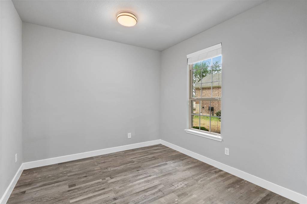 The cozy breakfast nook features neutral walls and a large window that lets natural light pour in, creating a bright and welcoming atmosphere. It’s the perfect space for a table to enjoy a casual meal or play cards with your new friends.