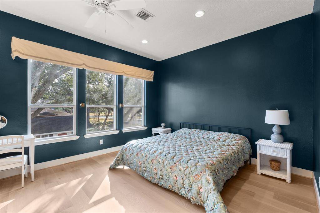 Imagine waking up in this primary suite with breathtaking second-story tree canopy views of the garden backyard.