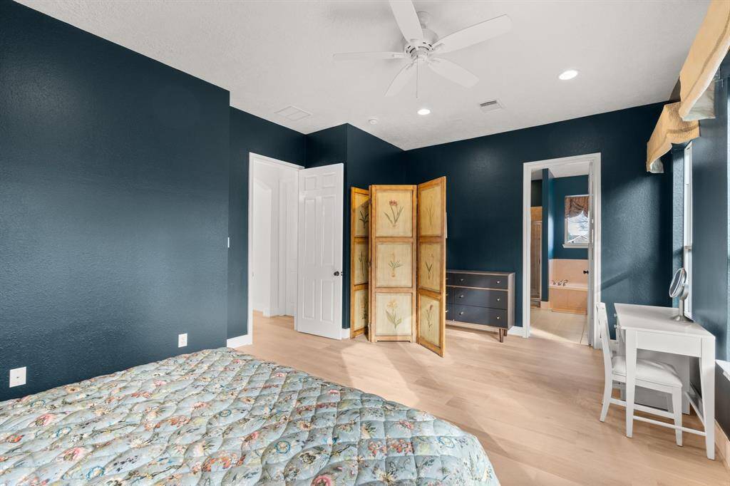 The primary bedroom is spacious and relaxing.