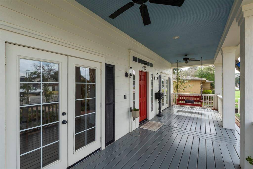 Imagine starting your morning on the spacious front porch, swaying on a cozy red bench swing, coffee in hand!