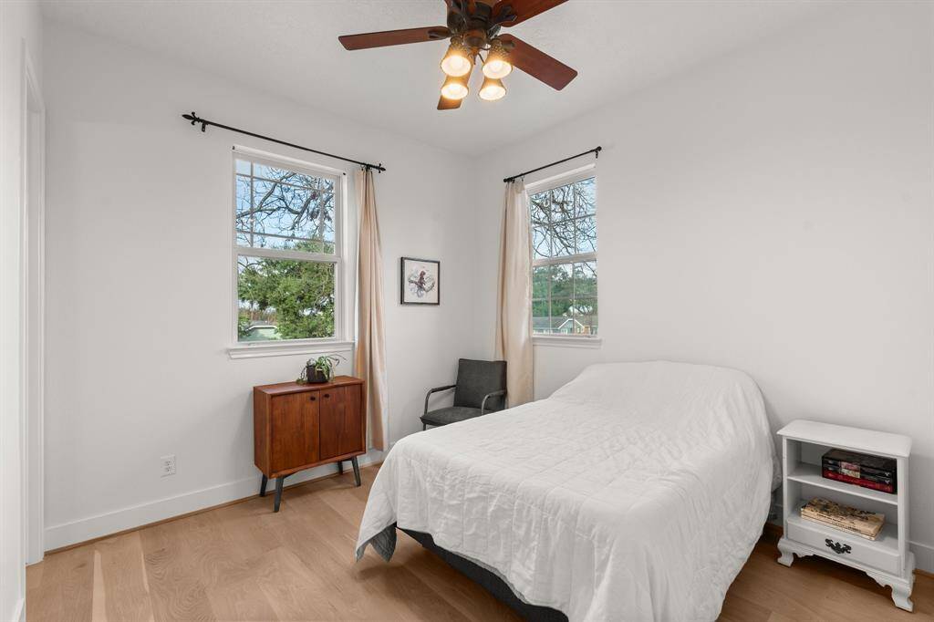The guest suite overlooks the front garden with views of majestic trees.