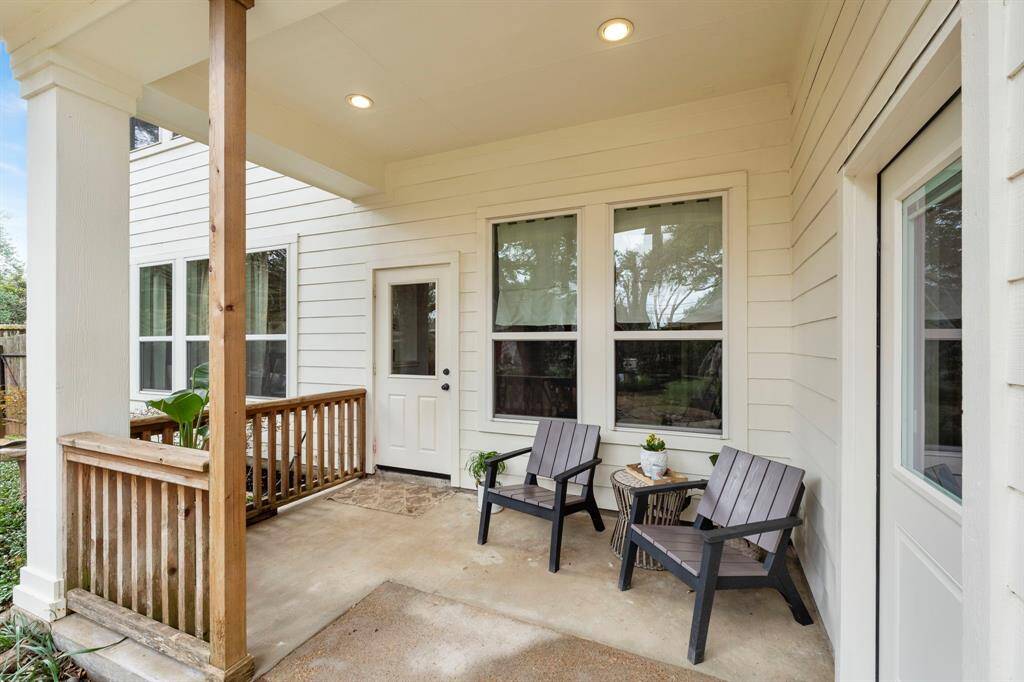 This spacious covered patio is overlooking the backyard (back door Left, guest house side entrance Right).