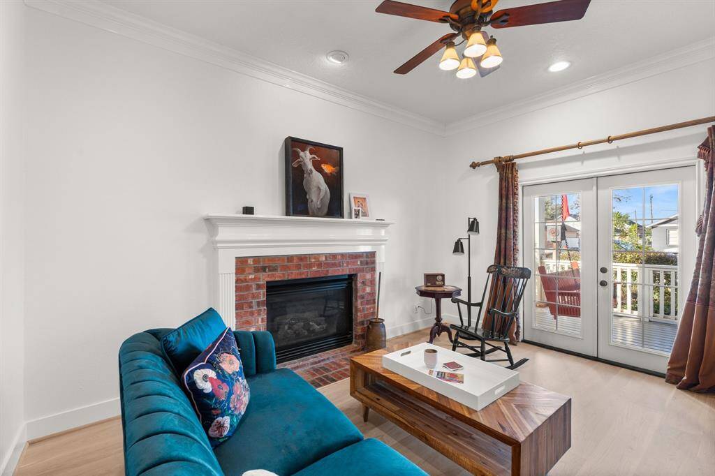 The formal living area features a cozy gas log fireplace and mantle.