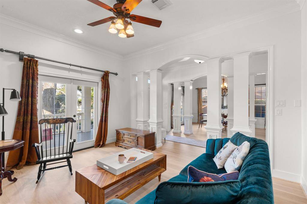 The formal living space also has French doors with access to the front porch swing!