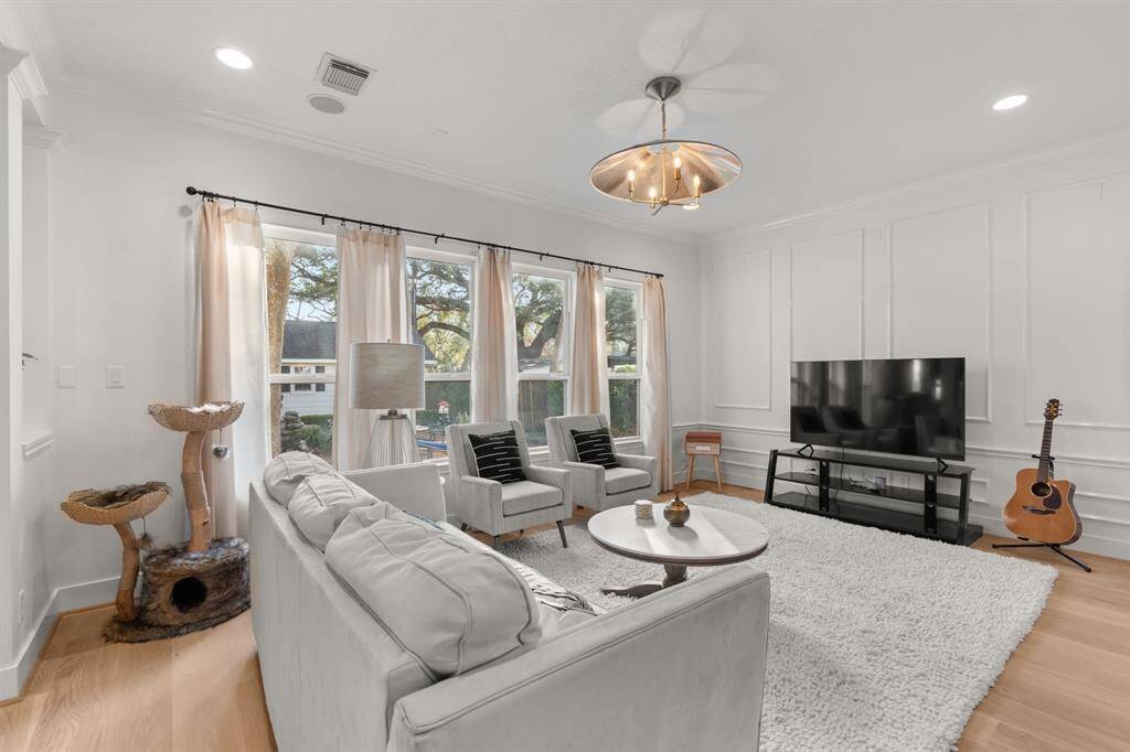 The family room is open and spacious, with tranquil views of your garden sanctuary!