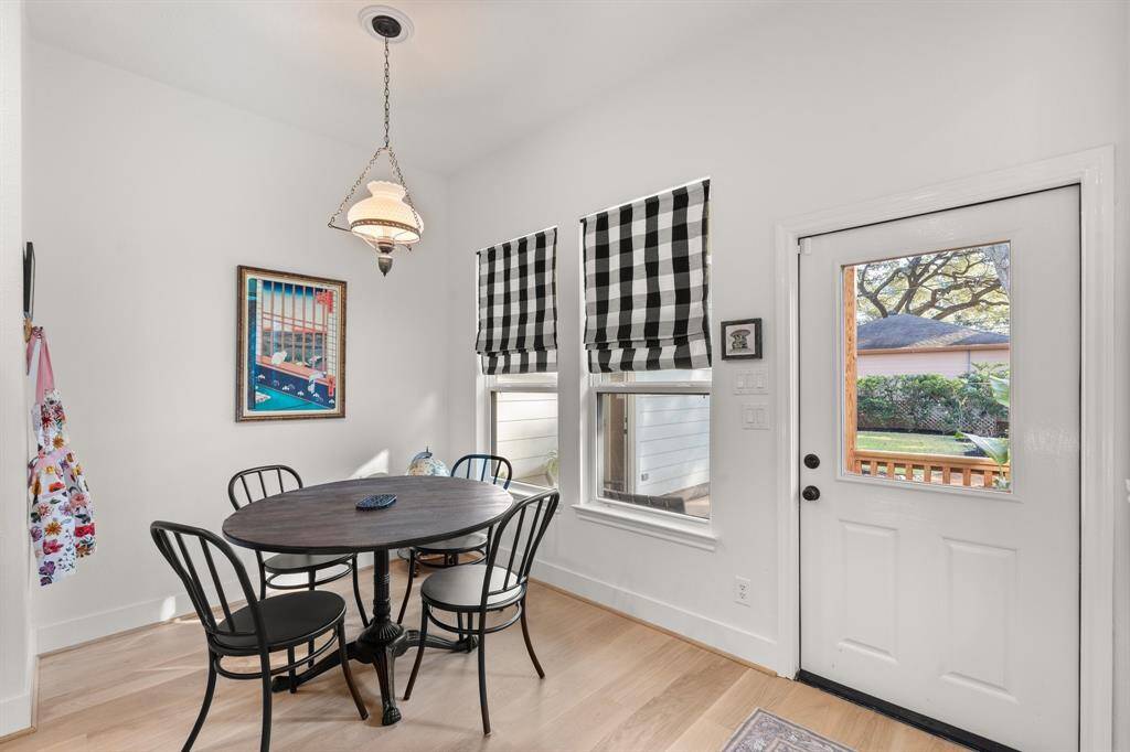 The charming breakfast nook looks out to the covered back patio.