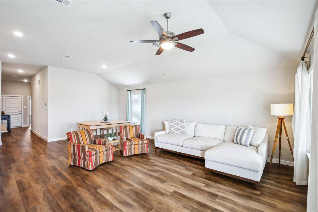Living room with door to the covered back porch.